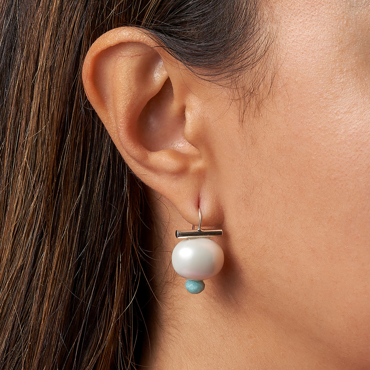 model with Sterling Sky Pebble Dot with small facetted aquamarine dot detail 